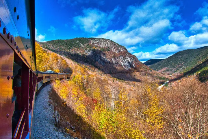 a sign on the side of a mountain
