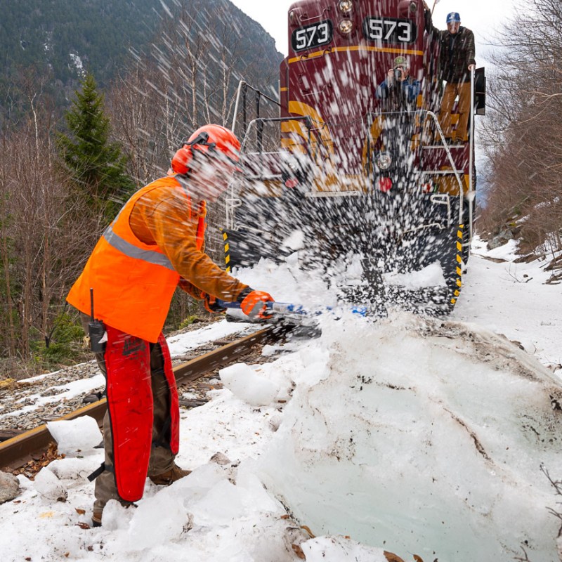 a man that is standing in the snow