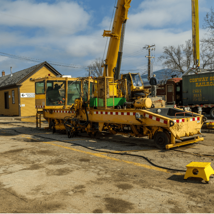 a truck driving down a dirt road