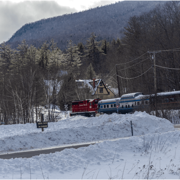 a person riding skis down a snow covered mountain
