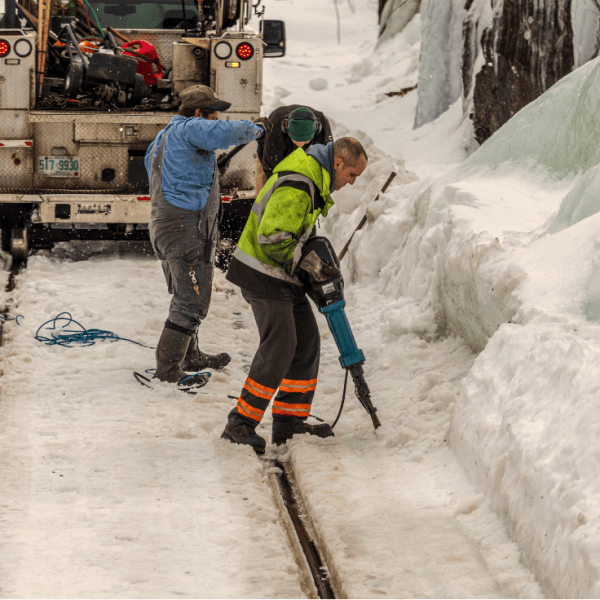 a man riding skis down a snow covered slope