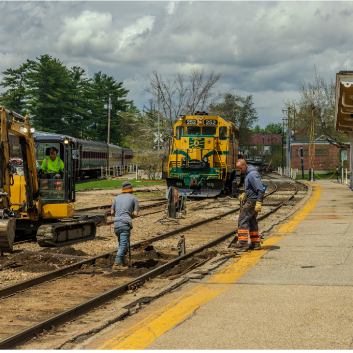 a group of people sitting at a train station